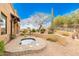 Private spa surrounded by desert landscaping at 14216 E Desert Cove Ave, Scottsdale, AZ 85259