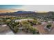 Aerial view of house, stables, and surrounding landscape at 14705 E Redbird Rd, Scottsdale, AZ 85262