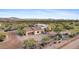 Aerial view of a single-story home with desert landscaping and mountain views at 14705 E Redbird Rd, Scottsdale, AZ 85262