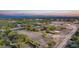 Aerial view of property showcasing house and equestrian facilities at 14705 E Redbird Rd, Scottsdale, AZ 85262