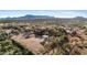 Aerial view of a luxurious ranch-style home with expansive desert views at 14705 E Redbird Rd, Scottsdale, AZ 85262