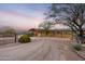 Exterior of barn with multiple stalls at sunset at 14705 E Redbird Rd, Scottsdale, AZ 85262