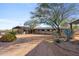 Exterior of barn with multiple stalls and landscaping at 14705 E Redbird Rd, Scottsdale, AZ 85262