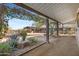 Exterior view of barn with stalls and landscaping at 14705 E Redbird Rd, Scottsdale, AZ 85262