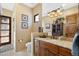 Bathroom with granite countertop and single sink vanity at 14705 E Redbird Rd, Scottsdale, AZ 85262