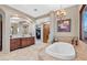 Spa-like bathroom featuring a soaking tub and walk-in shower at 14705 E Redbird Rd, Scottsdale, AZ 85262