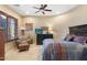 Bright bedroom with a ceiling fan and sitting area at 14705 E Redbird Rd, Scottsdale, AZ 85262