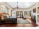 Spacious main bedroom with a king-size bed and wood flooring at 14705 E Redbird Rd, Scottsdale, AZ 85262