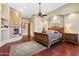 Main bedroom with fireplace, built-ins, and king bed at 14705 E Redbird Rd, Scottsdale, AZ 85262