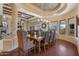 Elegant dining room with a large wood table and leather chairs at 14705 E Redbird Rd, Scottsdale, AZ 85262