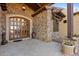 Stone entryway with double wood doors at 14705 E Redbird Rd, Scottsdale, AZ 85262