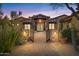 Stunning stone exterior with a gated entry and courtyard at 14705 E Redbird Rd, Scottsdale, AZ 85262