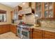 Kitchen features high-end appliances and custom cabinetry at 14705 E Redbird Rd, Scottsdale, AZ 85262