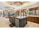 Large kitchen island with copper range hood and stainless steel appliances at 14705 E Redbird Rd, Scottsdale, AZ 85262