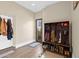 Convenient mudroom with coat hooks and built-in cubbies at 14705 E Redbird Rd, Scottsdale, AZ 85262
