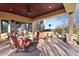 Covered patio with seating area and spiral staircase at 14705 E Redbird Rd, Scottsdale, AZ 85262