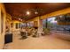 Relaxing covered patio with fireplace and seating area at 14705 E Redbird Rd, Scottsdale, AZ 85262
