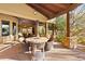 Large covered patio with seating and dining areas at 14705 E Redbird Rd, Scottsdale, AZ 85262