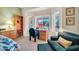 Bright bedroom with built-in desk and window seat with beautiful views at 15827 W Falcon Ridge Dr, Sun City West, AZ 85375