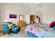 Comfortable bedroom with king-size bed and relaxing seating area at 15827 W Falcon Ridge Dr, Sun City West, AZ 85375