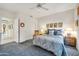 Spacious bedroom with a queen-size bed and ample closet space at 15827 W Falcon Ridge Dr, Sun City West, AZ 85375