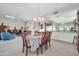 Bright dining area with a table, chairs, and views to the living room at 15827 W Falcon Ridge Dr, Sun City West, AZ 85375