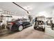 Garage with car, golf cart, and additional storage space at 15827 W Falcon Ridge Dr, Sun City West, AZ 85375
