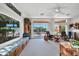 Spacious Gathering room with built-in window seat, sliding doors to patio, and comfortable seating at 15827 W Falcon Ridge Dr, Sun City West, AZ 85375