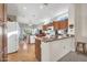 Well-equipped kitchen with wood cabinets and granite countertops at 15827 W Falcon Ridge Dr, Sun City West, AZ 85375