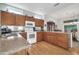 Well-equipped kitchen with wood cabinets and granite countertops at 15827 W Falcon Ridge Dr, Sun City West, AZ 85375