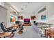 Bright living room with large windows, comfortable seating, and flat-screen TV at 15827 W Falcon Ridge Dr, Sun City West, AZ 85375