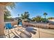 Relaxing patio area with seating, offering a tranquil view of the backyard at 15827 W Falcon Ridge Dr, Sun City West, AZ 85375