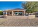 Covered patio with seating area and a built-in barbecue at 15827 W Falcon Ridge Dr, Sun City West, AZ 85375