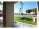 View of apartment complex parking lot with palm trees and landscaping at 1720 E Thunderbird Rd # 1111, Phoenix, AZ 85022