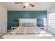 Spacious bedroom with king-size bed and teal accent wall at 17422 N 1St Dr, Phoenix, AZ 85023