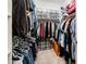 Large walk-in closet with ample shelving and hanging space at 17734 W Amber Ridge Way, Goodyear, AZ 85338