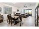 Open dining area with a rustic wooden table and seating for six at 17734 W Amber Ridge Way, Goodyear, AZ 85338