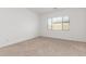 Bright bedroom with neutral carpet and window coverings at 18934 W Sierra St, Surprise, AZ 85388