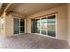 Covered patio with sliding glass doors and tile flooring at 18934 W Sierra St, Surprise, AZ 85388