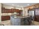 Modern kitchen with a large island and stone facing at 19957 N Rawhide Way, Surprise, AZ 85387