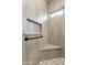 Shower with built-in shelves and a window at 19957 N Rawhide Way, Surprise, AZ 85387