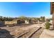 Large backyard with garden area, shed, and mountain views at 2070 N Don Peralta Rd, Apache Junction, AZ 85119