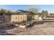 Backyard garden with raised beds and shade structure at 2070 N Don Peralta Rd, Apache Junction, AZ 85119