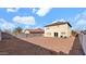 Spacious backyard with gravel and a two-story house at 219 E Beth Dr, Phoenix, AZ 85042
