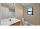 Neat bathroom, with a vanity, mirror and toilet at 219 E Beth Dr, Phoenix, AZ 85042