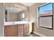 Double vanity bathroom with large mirror and natural light at 219 E Beth Dr, Phoenix, AZ 85042