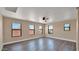 Spacious bedroom with wood floors and ceiling fan at 219 E Beth Dr, Phoenix, AZ 85042