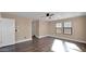 Bright bedroom with wood floors and two windows at 219 E Beth Dr, Phoenix, AZ 85042