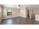 Spacious bedroom with wood-look floors and ceiling fan at 219 E Beth Dr, Phoenix, AZ 85042