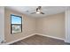 Well-lit bedroom with wood-look floors and large window at 219 E Beth Dr, Phoenix, AZ 85042